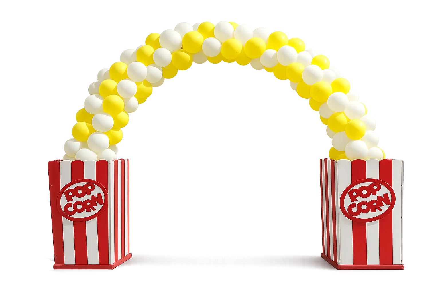 A themed photo backdrop with balloon columns and custom signage staged next to a row of red-and-white striped carnival booths